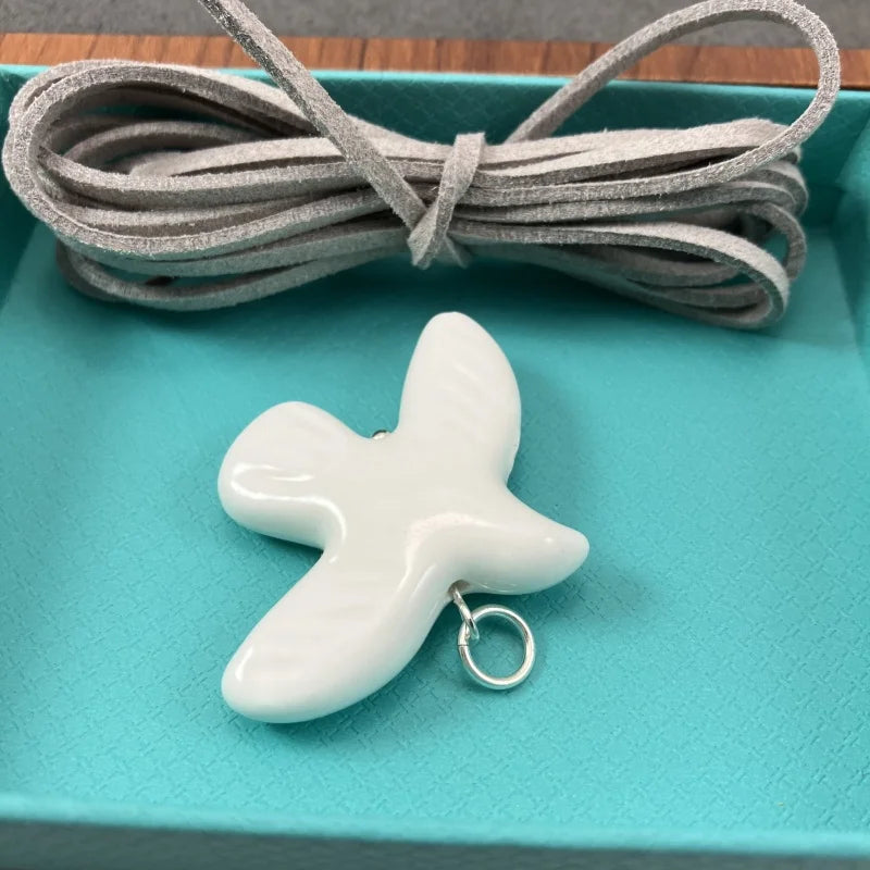 High-Grade White Ceramic Bird Peace Dove Pendant Necklace - Velvet Wax Rope