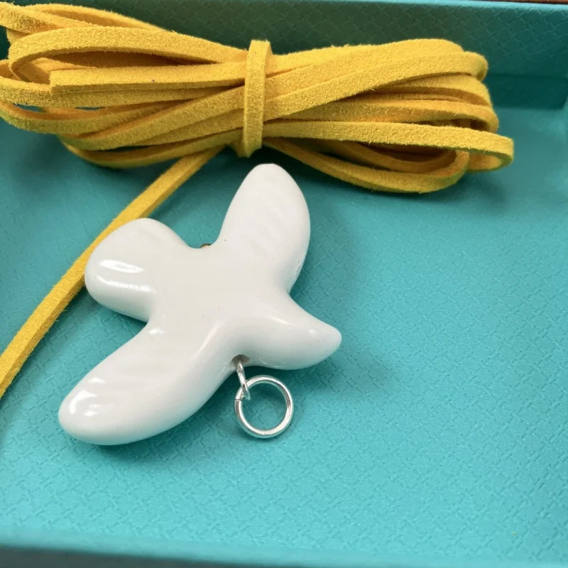 High-Grade White Ceramic Bird Peace Dove Pendant Necklace - Velvet Wax Rope