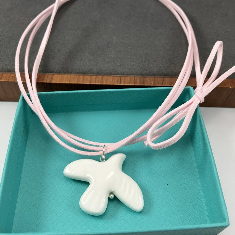 High-Grade White Ceramic Bird Peace Dove Pendant Necklace - Velvet Wax Rope