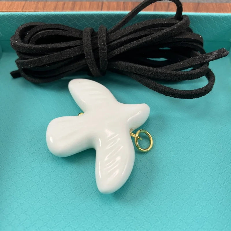 High-Grade White Ceramic Bird Peace Dove Pendant Necklace - Velvet Wax Rope