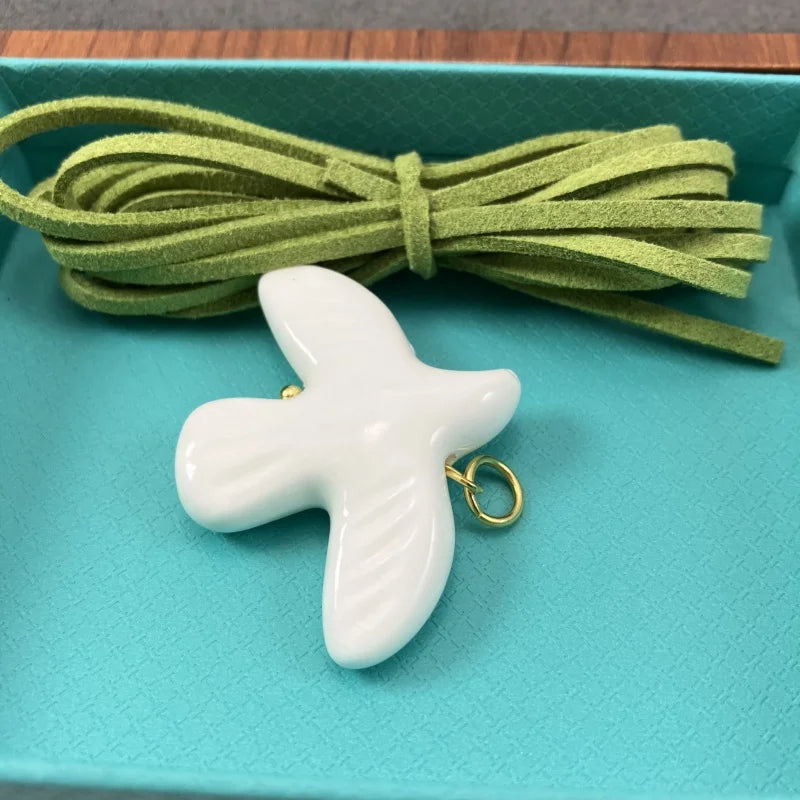 High-Grade White Ceramic Bird Peace Dove Pendant Necklace - Velvet Wax Rope