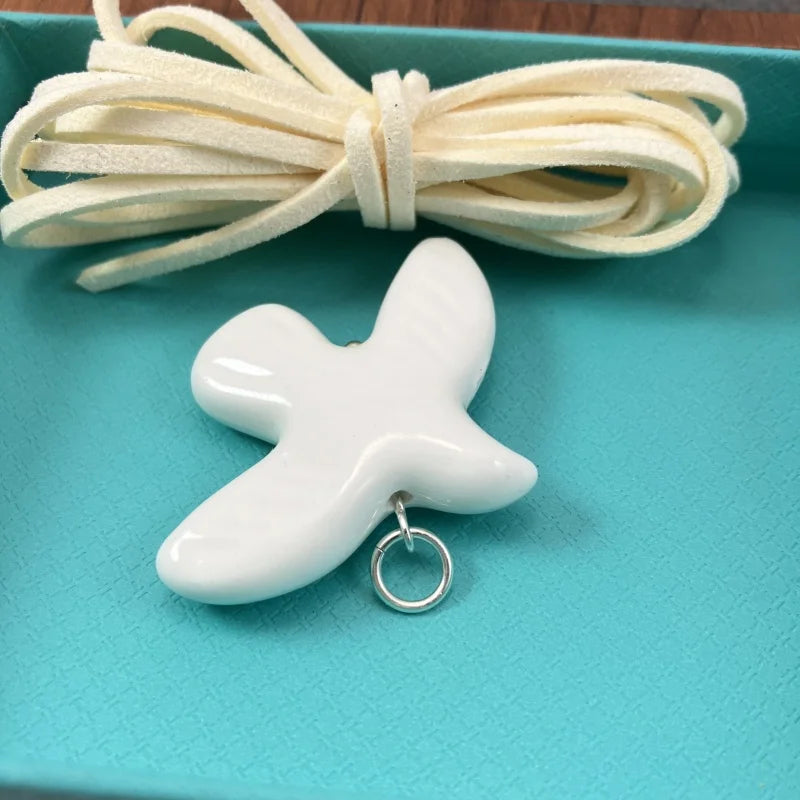 High-Grade White Ceramic Bird Peace Dove Pendant Necklace - Velvet Wax Rope