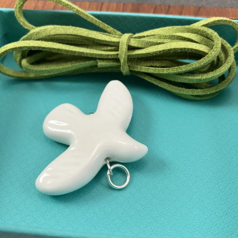 High-Grade White Ceramic Bird Peace Dove Pendant Necklace - Velvet Wax Rope