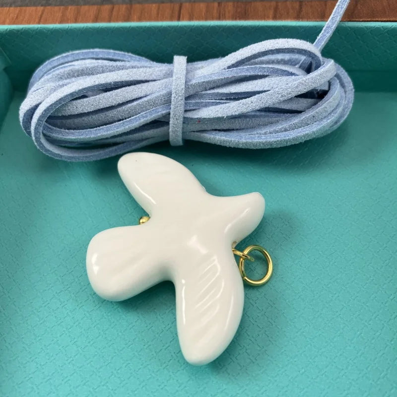 High-Grade White Ceramic Bird Peace Dove Pendant Necklace - Velvet Wax Rope