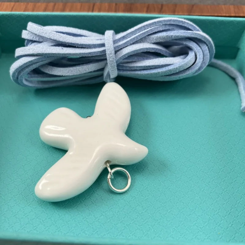 High-Grade White Ceramic Bird Peace Dove Pendant Necklace - Velvet Wax Rope