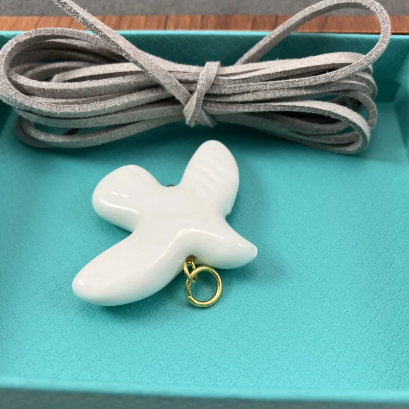 High-Grade White Ceramic Bird Peace Dove Pendant Necklace - Velvet Wax Rope