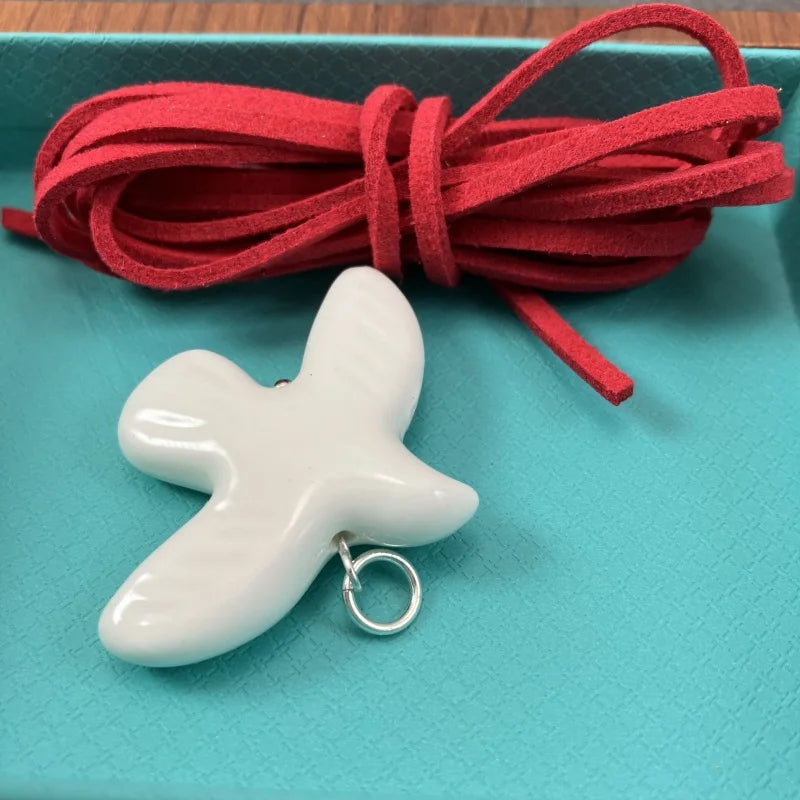 High-Grade White Ceramic Bird Peace Dove Pendant Necklace - Velvet Wax Rope